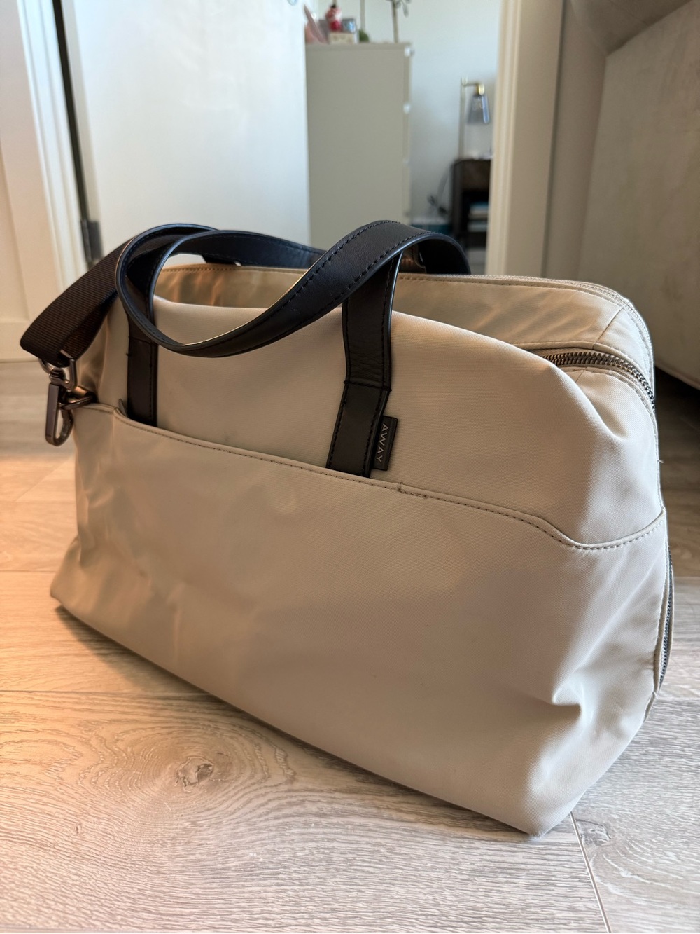 Away Beige Travel Bag with Black Handles